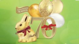 imagem do coelho de chocolate da Lindt, com bolas de ar douradas e o número 70 com um laço vermelho, além de uma inscrição gold bunny 70 anos