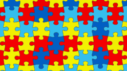 imagem de um quebra cabeças com as cores azul em dois tons, vermelho e amarelo