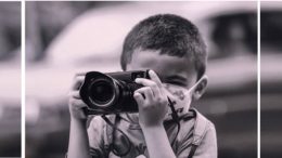 imagem em preto e branco de menino do MTST segurando uma camera fotográfica profissional, ele tem cabelo bem curto e usa márcara