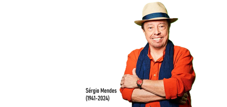 imagem de Sergio Mendes sorrindo de braços cruzados, a legenda "Sergio Mendes 1941-2024"