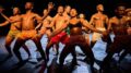 grupo de bailarinos negros e pardos sem camisa - mulhers com top - em pé curvados para trás, gritando