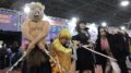 quatro cosplayers vestidos com personagens de demons layer